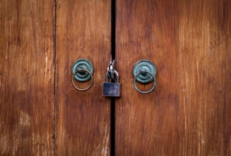 shutterstock locked double door | Intellectual Property Law Firm | Harness IP