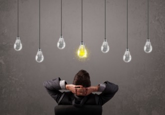 shutterstock lightbulb and man | Intellectual Property Law Firm | Harness IP