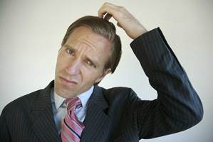 Can Unexpected Results Make the Obvious Non-Obvious? | IP Law Firm | Harness IP Confused Business Man | Intellectual Property Law Firm | Harness IP
