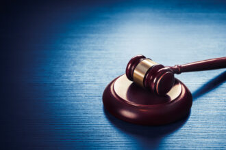 judge gavel on a blue wooden background