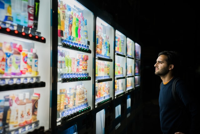Man considering ip rights of vending machines