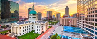 St. Louis, Missouri, USA downtown cityscape with the old courthouse at dusk.